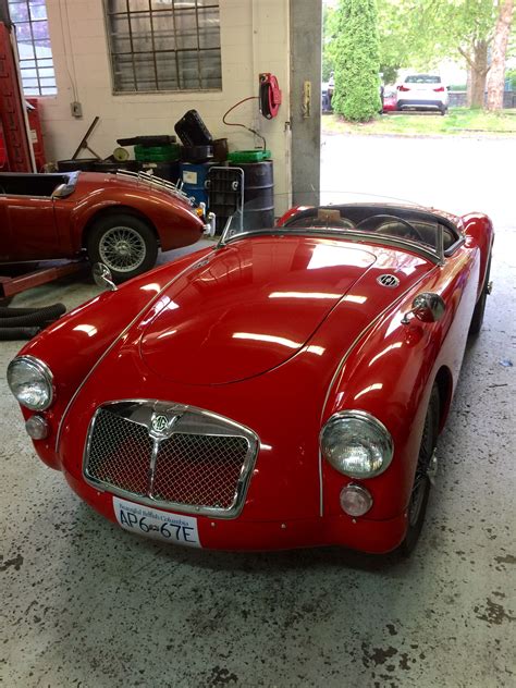 Red MGA racing | Vintage sports cars, British sports cars, Retro cars