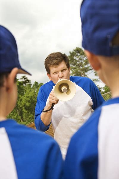 Coach yelling at young baseball players through megaphone Free Photo Download | FreeImages