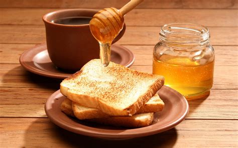 Sweet Morning Bliss: HD Wallpaper of Toast with Honey and Coffee