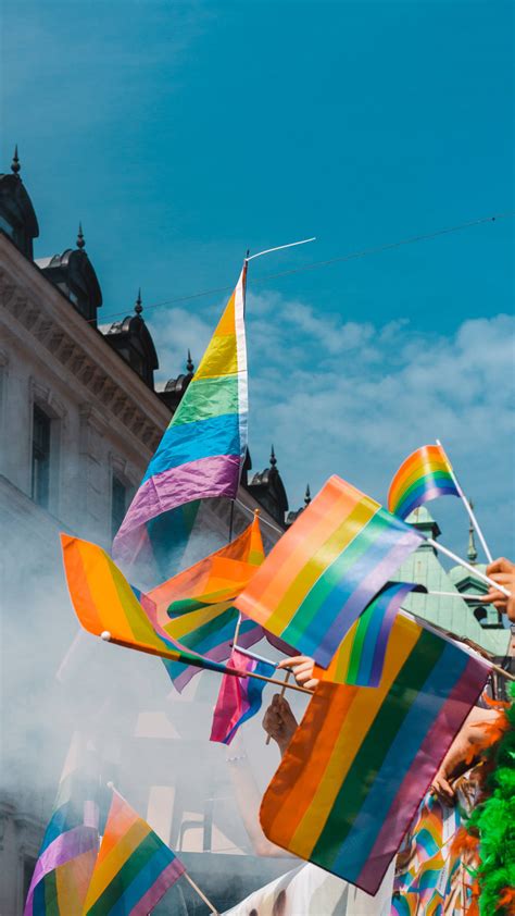 Download Vibrant LGBT Pride Flags on Phone Screen Wallpaper | Wallpapers.com