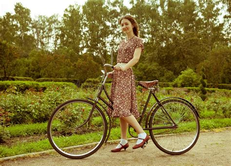 Young Woman In Dress Posing With Retro Bicycle In The Park. Stock Photo ...