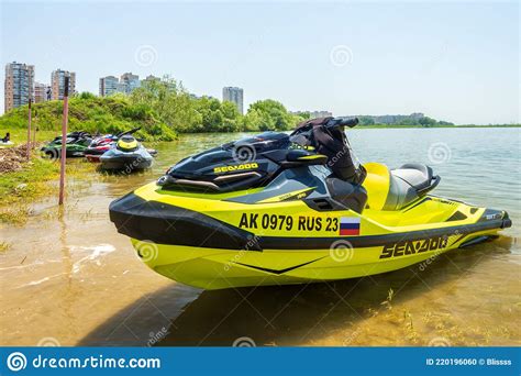 Close Up of New BRP Sea-Doo Jet Ski with Logo Resting on Water by River Bank at Countryside ...