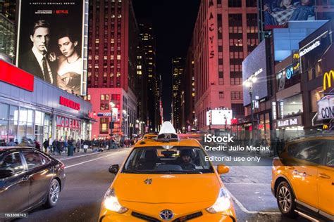 New York City Taxi At Night At A Crosswalk By Madison Square Garden ...