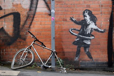 Banksy claims new hula-hooping girl street art in Britian | Daily Sabah