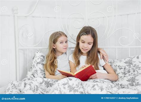 Older Sister Read Younger Book in Quarantine. Stock Image - Image of home, leisure: 178516337