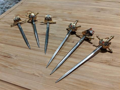 Went to donate a bunch of stuff, left with some vintage, miniature Toledo cocktail swords ...