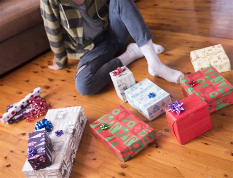 Photo of A person sitting in front of Christmas gifts | Free christmas ...