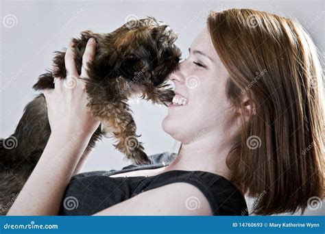 Puppy kisses stock image. Image of indoors, kissing, smile - 14760693