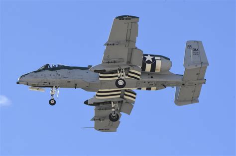 An A-10 Thunderbolt II, assigned to the A-10C Thunderbolt II Demonstration Team, flies with ...