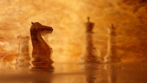 Premium Photo | Glass knight on a glass floor on blur burning chess ...