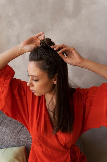 Premium Photo | Young woman with messy bun