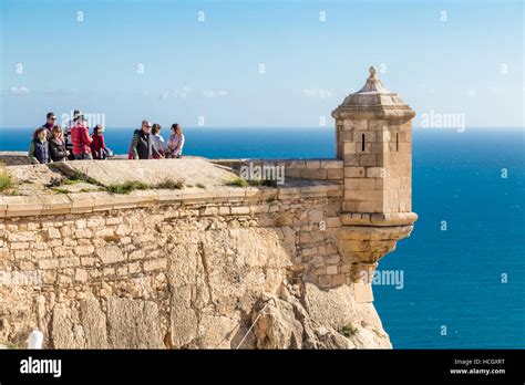 Santa Barbara Castle, Castell de la Santa Bàrbara, Alicante, Spain, tourists on battlements with ...