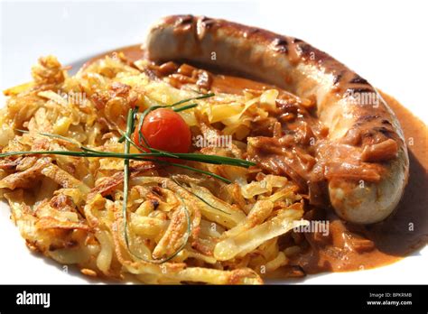 Bratwurst and potato rosti - classic Swiss dinner. Rosti is the ...