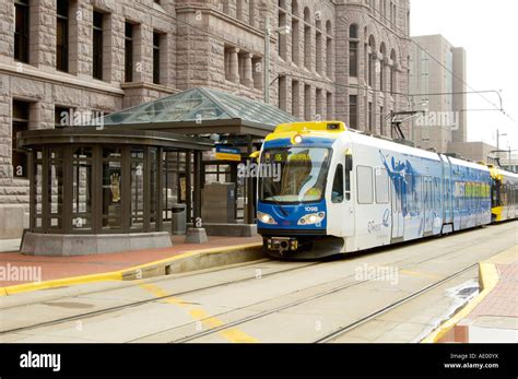 a light rail mass transit train in front of the government plaza building in Minneapolis ...