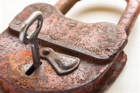 Old lock with a key 8172848 Stock Photo at Vecteezy