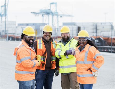 Multi-ethnic dock workers at shipping port - Subcontractors USA