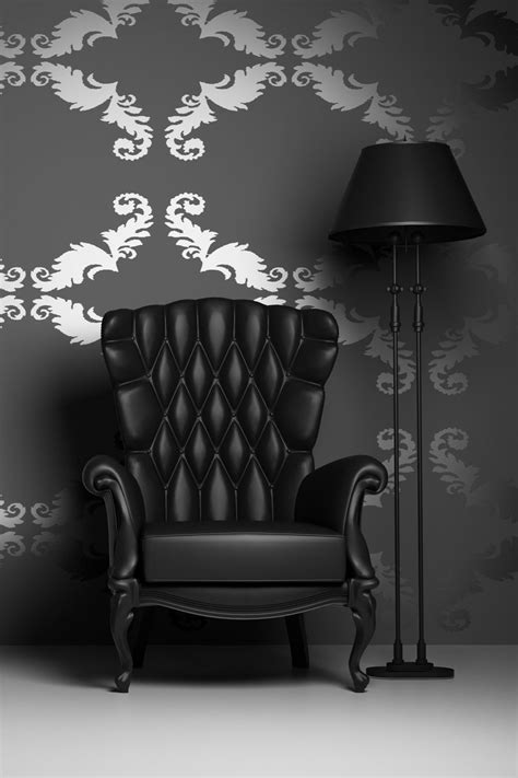Black leather chair and lamp in a room with black and silver wallpaper Wallpaper Design For ...