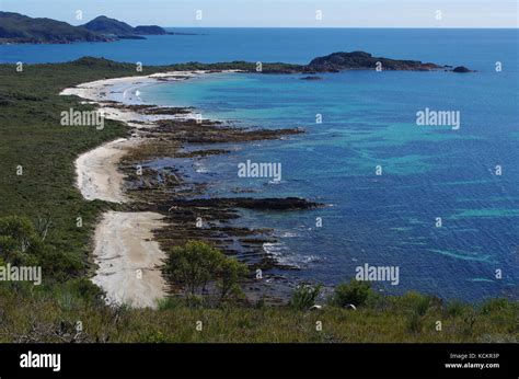 Coastline of tortured quartzite Pre-cambrian rocks that have undergone intensive folding over ...