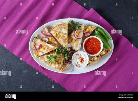 mexican chicken quesadillas with vegetables, corn kernels, shredded ...