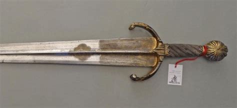 Cinquedea Sword Dated: circa 1530 Culture: Italian The sword has an etched blade that is ...