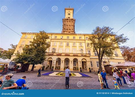 LVIV, UKRAINE - SEPTEMBER 12, 2016: Lviv City and Lviv Old Town with People. Sunset Light and ...