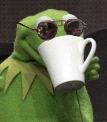 kermie the frog wearing sunglasses and holding a coffee cup