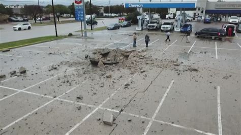 Lightning strike leaves behind 15-foot crater in Fort Worth parking lot ...