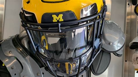 Michigan Wolverines adjust to new football helmet shield to combat ...