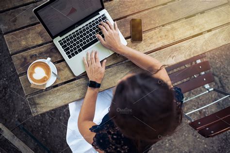 Woman working on her laptop outdoors | High-Quality Technology Stock Photos ~ Creative Market