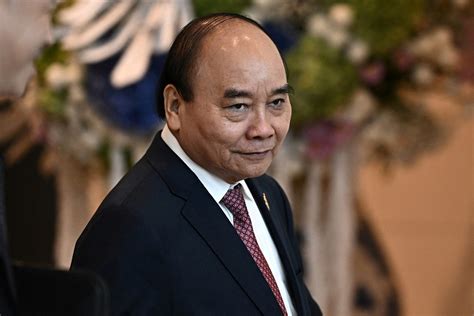 Vietnam's President Phuc quits, blamed for ministers' 'violations'