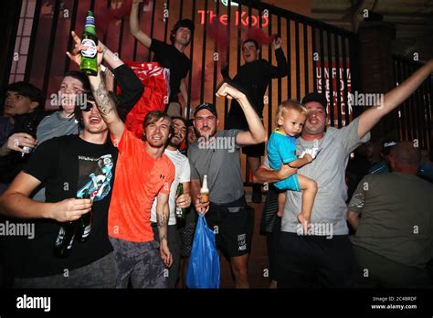 Liverpool fans celebrate outside Anfield, Liverpool Stock Photo - Alamy