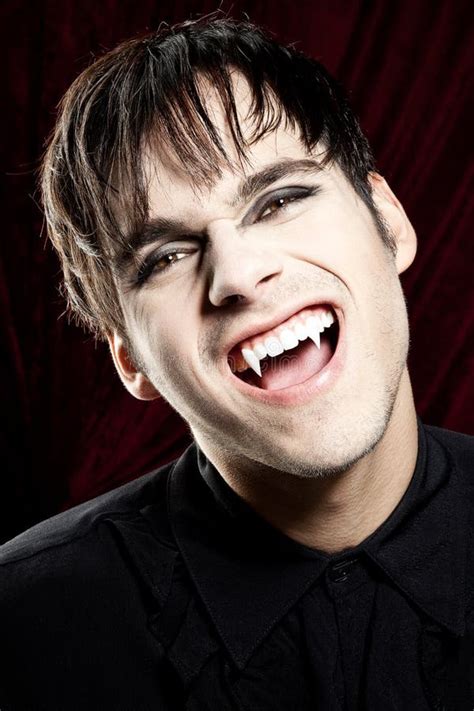 Male Vampire Smiling Dangerously, Showing Fangs Stock Photo - Image of black, blood: 26311950