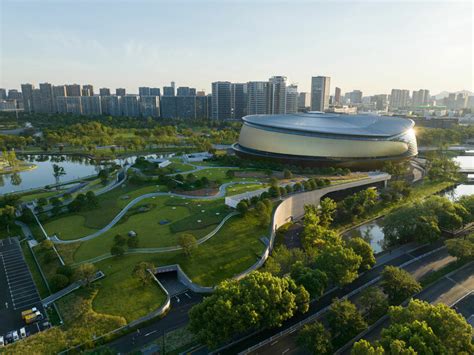 archi-tectonics' hybrid stadium in hangzhou takes cues from the chinese cong