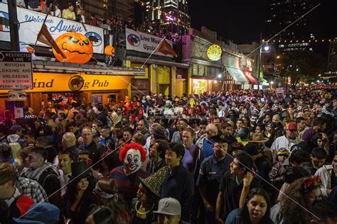 Costume revelers haunt the packed streets of 6th Street on Halloween in Austin, Texas. 6th ...