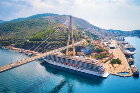 Aerial View of Cruise Ship Under Beautiful Bridge at Sunset Stock Photo - Image of highway, dock ...