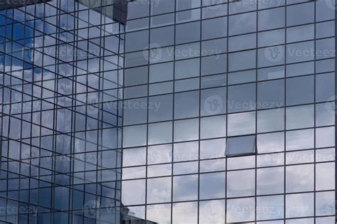 Sky and clouds reflection in the windows of modern skyscraper 9666442 Stock Photo at Vecteezy