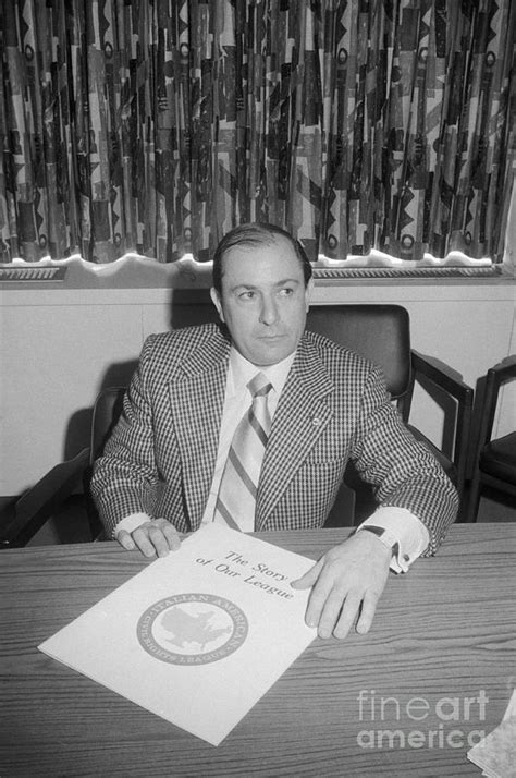 Joe Colombo Sitting Behind Desk by Bettmann