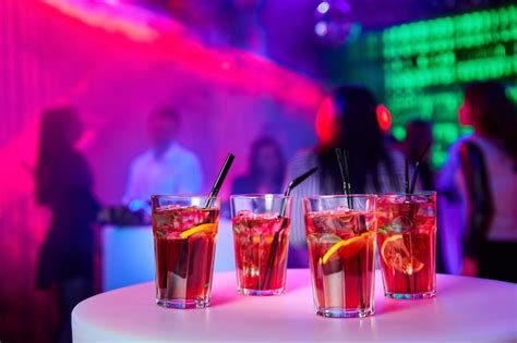 Premium Photo | Alcoholic cocktails in a nightclub against the backdrop ...