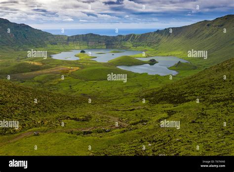 Aerial view of volcanic crater (Caldeirao) with a beautiful lake on the ...