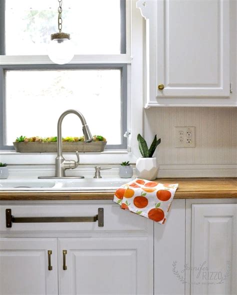 Sink area mini-makeover with brass towel bar under the sink - Jennifer ...