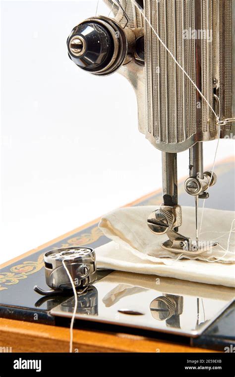 Sewing machine and parts on a white background Stock Photo - Alamy