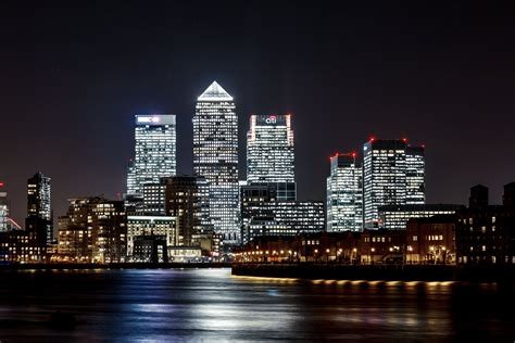 panorama photo of buildings, canary wharf, canary wharf Lights on ...