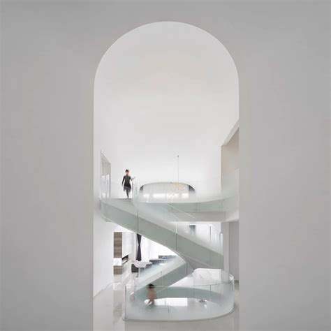 Grand spiral staircase dominates Cloud Villa in Shanghai by KOS Architects