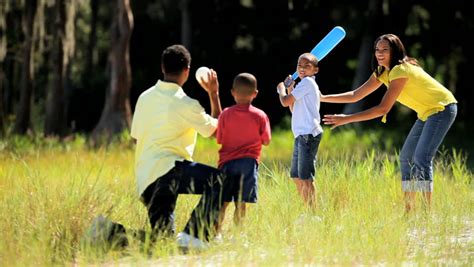 Healthy Young Ethnic Family Having Fun Playing Baseball Together In The Park Stock Footage Video ...