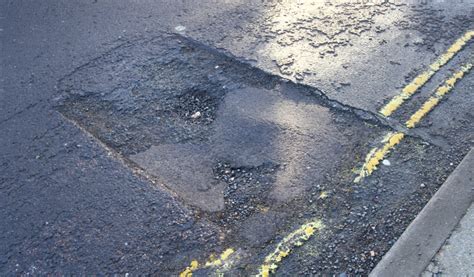 ISLAND ROADS CONTINUE TO PATCH POTHOLES CAUSED BY 'PERFECT STORM ...