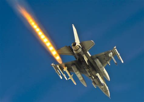 An F-16 fires a HARM missile during a weapons system evaluation program mission at Hill AFB ...