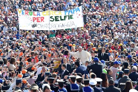 Pope Francis is begged for a picture by crowds at Jubilee of Mercy ceremony at The Vatican ...