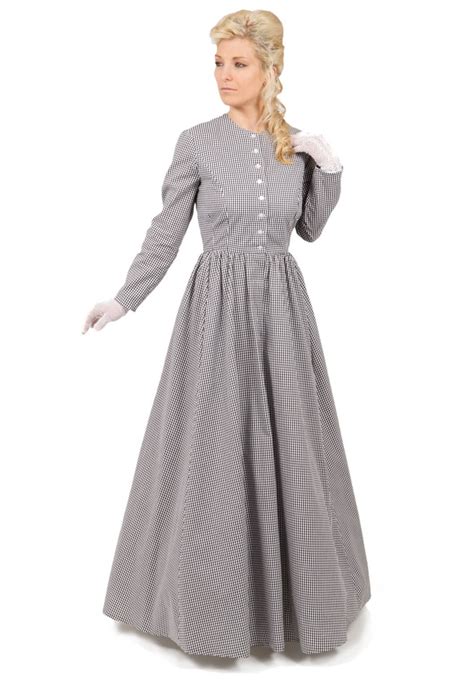 Traditional Victorian calico dress has fitted bodice with front button closure. Dress has simple ...