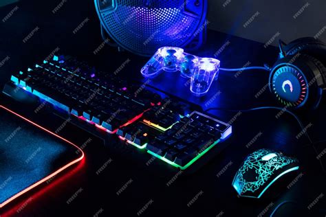 Free Photo | View of illuminated neon gaming keyboard setup and controller