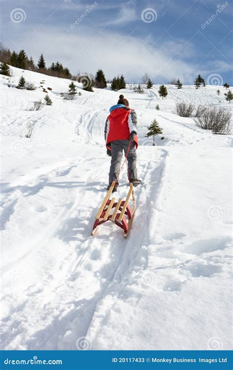 Pre-teen Boy Pulling A Sled In The Snow Stock Photos - Image: 20117433